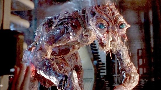 David Cronenberg’s The Fly (1986) is considered a genre-defining classic. Watch it to see Jeff Goldblum lose his nails, vomit corrosive enzymes, and slowly turn into an insect-human hybrid. The film earned Chris Walas and Stephan Dupuis an Oscar for makeup and prosthetics.