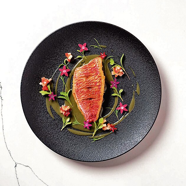 Iyer’s Yelakki Kathai, or red mullet in a sauce featuring native bananas, garnished with jungle geraniums. Iyer’s Yelakki Kathai, or red mullet in a sauce featuring native bananas, garnished with jungle geraniums.