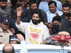 Allu Arjun greets his fans in Hyderabad as leaves a hospital where he was taken for medical checkup by policemen before arresting him. Allu Arjun greets his fans in Hyderabad as leaves a hospital where he was taken for medical checkup by policemen before arresting him.
