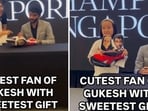 The image captures D Gukesh’s interaction with a sweet fan. The image captures D Gukesh’s interaction with a sweet fan.