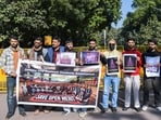 Jammu and Kashmir Students Association (JKSA) supporters holding placards protest urging the government to revise the new reservation policy, at Jantar Mantar in New Delhi on Saturday. (ANI) Jammu and Kashmir Students Association (JKSA) supporters holding placards protest urging the government to revise the new reservation policy, at Jantar Mantar in New Delhi on Saturday. (ANI)