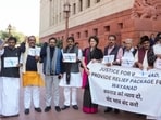  Congress MP Priyanka Gandhi Vadra and others stage a protest demanding a relief package for landslide-hit Wayanad during the Winter session of Parliament, in New Delhi, 