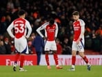 Arsenal's Thomas Partey and Jorginho look dejected after the match.
