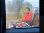 A handcuffed criminal rode a bike in Mainpuri, while a cop sat behind.
A handcuffed criminal rode a bike in Mainpuri, while a cop sat behind.