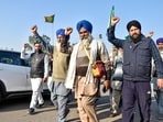 Farmers raise slogans as they gather at their protest site at Shambhu border for their 'Delhi Chalo' protest march. 