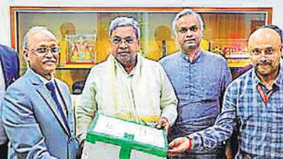 A commission of inquiry headed by Justice John Michael D. Kunhar submitted its inquiry report on alleged COVID-19 irregularities during BJP regime to the Karnataka Chief Minister Siddaramaiah, in Bengaluru. (ANI) A commission of inquiry headed by Justice John Michael D. Kunhar submitted its inquiry report on alleged COVID-19 irregularities during BJP regime to the Karnataka Chief Minister Siddaramaiah, in Bengaluru. (ANI)