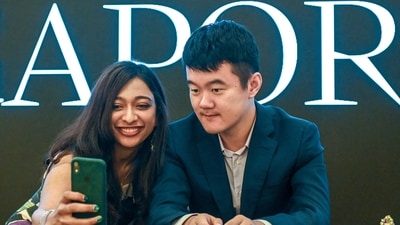 China's grandmaster Ding Liren (R) poses for a selfie during a meet and greet session after the World Chess Championship 2024 in Singapore (AFP) China's grandmaster Ding Liren (R) poses for a selfie during a meet and greet session after the World Chess Championship 2024 in Singapore (AFP)