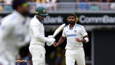 India's paceman Jasprit Bumrah reacts after a delivery to Australia's Usman Khawaja (C) on the first day of the third cricket Test match. (Photo by David GRAY / AFP) (AFP) India's paceman Jasprit Bumrah reacts after a delivery to Australia's Usman Khawaja (C) on the first day of the third cricket Test match. (Photo by David GRAY / AFP) (AFP)