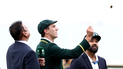 Rohit Sharma and Pat Cummins involved in the toss at the Gabba in Brisbane for the third Test match. (AFP)