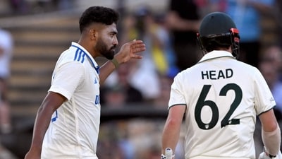 Indian bowler Mohammed Siraj (L) gestures to Australian batsman Travis Head (R). (Photo by William WEST / AFP) (AFP)