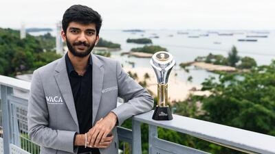 D Gukesh poses with the FIDE World Chess Championship trophy in Singapore on Friday. (PTI) D Gukesh poses with the FIDE World Chess Championship trophy in Singapore on Friday. (PTI)