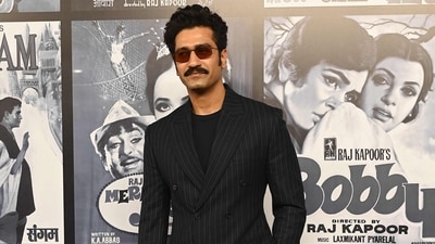 Bollywood actor Vicky Kaushal poses for a photograph during an event marking the 100th birth anniversary of legendary Indian actor and filmmaker Raj Kapoor in Mumbai on December 13. He was in a striped black suit. (AFP)