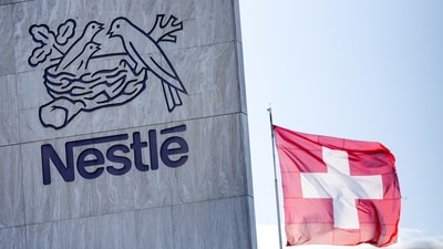 A Swiss flag flutters on the headquarters of Nestle in Vevey, Switzerland, November 25, 2024. REUTERS/Denis Balibouse