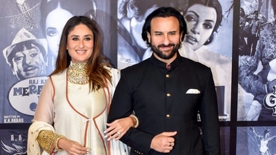 Ranbir Kapoor's famous cousin, Kareena Kapoor, and her actor-husband Saif Ali Khan were more than comfortable upping the glam quotient in their regal ensembles; Kareena was spotted in an Iqbal Hussain kurta and pyjama set at the Raj Kapoor 100th birth anniversary celebration on Friday, while Saif looked handsome in a black bandhgala suit. (PTI)