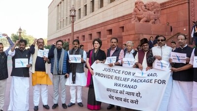 Congress MP Priyanka Gandhi Vadra and others stage a protest demanding a relief package for landslide-hit Wayanad during the Winter session of Parliament, in New Delhi, (PTI) Congress MP Priyanka Gandhi Vadra and others stage a protest demanding a relief package for landslide-hit Wayanad during the Winter session of Parliament, in New Delhi, (PTI)
