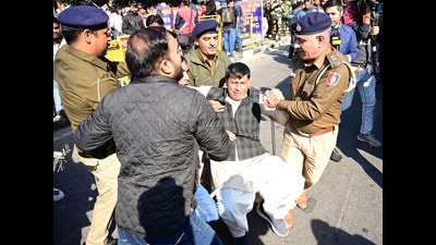 Police detaining Congress activists protesting at the Sector 18-19 light point in Chandigarh on Saturday. (Ravi Kumar/HT) Police detaining Congress activists protesting at the Sector 18-19 light point in Chandigarh on Saturday. (Ravi Kumar/HT)