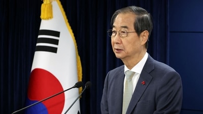 Acting South Korean President and Prime Minister Han Duck-soo delivers an address to the nation at the government complex in Seoul, South Korea on December 14. (REUTERS)