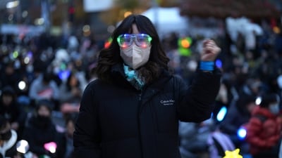 Not solely restricted to light sticks, the demonstrators wore other neon light-emitting accessories like goggles as well. (AP Photo/Lee Jin-man) Not solely restricted to light sticks, the demonstrators wore other neon light-emitting accessories like goggles as well. (AP Photo/Lee Jin-man)