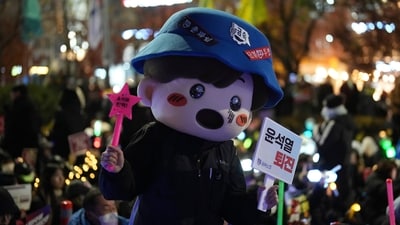 Even cartoon mascots were brought to the rally other than vibrant light sticks. (AP Photo/Lee Jin-man) Even cartoon mascots were brought to the rally other than vibrant light sticks. (AP Photo/Lee Jin-man)