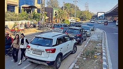 Vehicles parked outside hotels on Ferozepur road in Ludhiana on Saturday. (HT Photo)