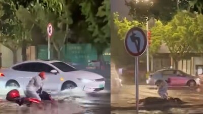 Driver, bystanders rescue biker in torrent. (Instagram/@give_india)