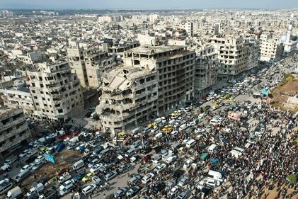 This aerial photo shows Syrians gathering near a destroyed building in the central city of Homs as they celebrate the fall of Bashar al-Assad's iron-fisted rule earlier this week, on December 13, 2024. (AFP) This aerial photo shows Syrians gathering near a destroyed building in the central city of Homs as they celebrate the fall of Bashar al-Assad's iron-fisted rule earlier this week, on December 13, 2024. (AFP)