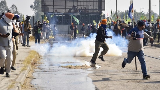 Security personnel use tear gas to disperse farmers agitating at Shambhu border, in Patiala district, Punjab, Saturday, Dec. 14, 2024. (PTI)