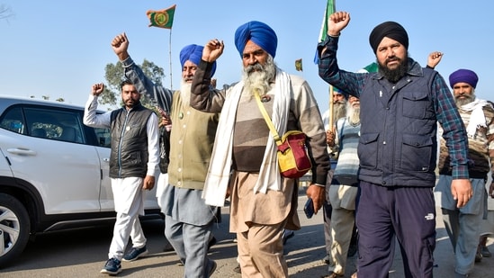 Farmers raise slogans as they gather at their protest site at Shambhu border for their 'Delhi Chalo' protest march. (PTI)