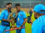 Mumbai's captain Shreyas Iyer and Suryansh Shedge pose for photographs with the championship trophy after winning the T20 cricket final match of the Syed Mushtaq Ali Trophy.