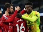 Manchester United's Amad Diallo, Bruno Fernandes and Andre Onana celebrate after the match. 
