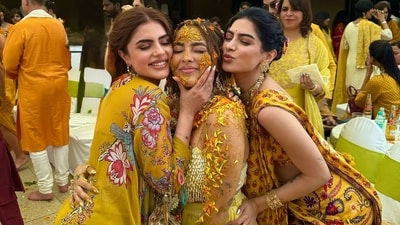 For Aaliyah's haldi ceremony, Khushi wore a stunning yellow pre-draped saree and a backless blouse. For Aaliyah's haldi ceremony, Khushi wore a stunning yellow pre-draped saree and a backless blouse.