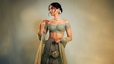 Khushi wore a green lehenga from Falguni Shane Peacock. The figure-hugging set featured a floating skirt with an A-line silhouette, and a matching blouse with an off-the-shoulder neckline. Khushi wore a green lehenga from Falguni Shane Peacock. The figure-hugging set featured a floating skirt with an A-line silhouette, and a matching blouse with an off-the-shoulder neckline.