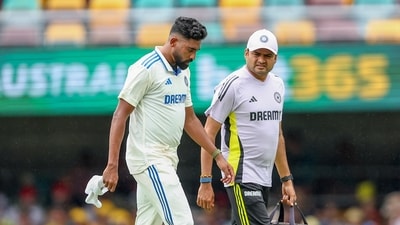 India's Mohammed Siraj, left, walks off the field after an injury during play on day two of the third cricket test between India and Australia. (AP Photo/Pat Hoelscher) (AP) India's Mohammed Siraj, left, walks off the field after an injury during play on day two of the third cricket test between India and Australia. (AP Photo/Pat Hoelscher) (AP)