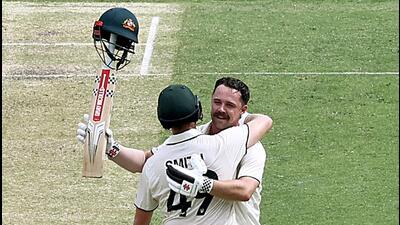 Australia’s Travis Head celebrates his century with Steve Smith during their 241-run partnership on Day 2 of the third Test against India at the Gabba in Brisbane on Sunday. Head hit 152 and Smith 101. (ICC- X) Australia’s Travis Head celebrates his century with Steve Smith during their 241-run partnership on Day 2 of the third Test against India at the Gabba in Brisbane on Sunday. Head hit 152 and Smith 101. (ICC- X)