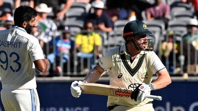 Australia's Travis Head (R) runs between the wickets as India's Jasprit Bumrah (C) looks on. (AFP) Australia's Travis Head (R) runs between the wickets as India's Jasprit Bumrah (C) looks on. (AFP)