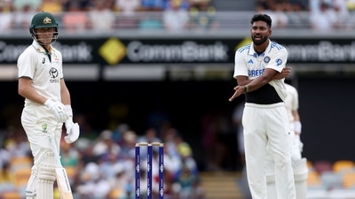 India's bowler Mohammed Siraj (R) reacts after an unsuccessful leg-before-wicket appeal against Australia's Marnus Labuschagne on day two of the third cricket Test match between Australia and India at The Gabba (AFP)