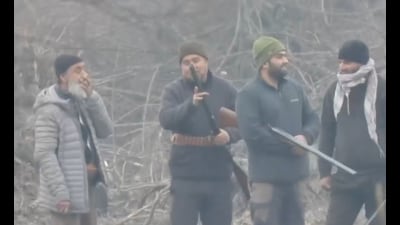 Farooq A Boktoo (on left) with other gunmen caught on CCTV at Wullar. (WULLAR CONSERVATION & MANAGEMENT AUTHORITY) Farooq A Boktoo (on left) with other gunmen caught on CCTV at Wullar. (WULLAR CONSERVATION & MANAGEMENT AUTHORITY)