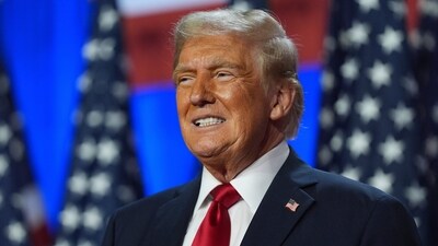 Donald Trump smiles at an election night watch party at the Palm Beach Convention Center. (AP File) Donald Trump smiles at an election night watch party at the Palm Beach Convention Center. (AP File)