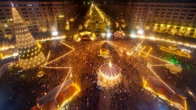 People visit a Christmas fair in Bucharest, Romania on Saturday, December 14, 2024. It has almost everything you can find at any other Christmas market: traditional food, a carousel, a stage where performances take place. (AP) People visit a Christmas fair in Bucharest, Romania on Saturday, December 14, 2024. It has almost everything you can find at any other Christmas market: traditional food, a carousel, a stage where performances take place. (AP)