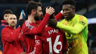 Manchester United's Amad Diallo, Bruno Fernandes and Andre Onana celebrate after the match. (REUTERS)