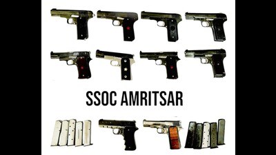 The seized arms and ammunition in Amritsar on Sunday. (HT photo) The seized arms and ammunition in Amritsar on Sunday. (HT photo)