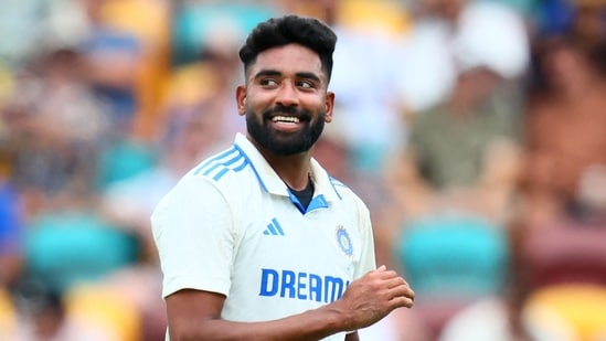 India's bowler Mohammed Siraj prepares to bowl on day two of the third cricket Test match between Australia and India at The Gabba.(Photo by Patrick Hamilton / AFP)/