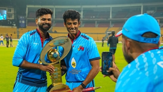 Mumbai's captain Shreyas Iyer and Suryansh Shedge pose for photographs with the championship trophy after winning the T20 cricket final match of the Syed Mushtaq Ali Trophy. (PTI)