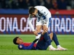  FC Barcelona's Lamine Yamal reacts after sustaining an injury as Leganes' Javi Hernandez looks on.