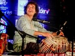 FILE: Ustad Zakir Hussain performs during the 100th birth anniversary of his father Ustad Alla Rakha, in Ahmedabad.