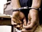 the accused, identified as Anand Kumar, was detained by Anekal police following a complaint filed by the deputy registrar of Lokayukta. the accused, identified as Anand Kumar, was detained by Anekal police following a complaint filed by the deputy registrar of Lokayukta.