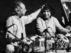Tabla maestro Zakir Hussain on stage with his legendary father Allah Rakha in an old photo.
