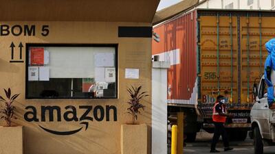 A man inspects trucks before they enter an Amazon storage facility on the outskirts of Mumbai. (REUTERS FILE PHOTO) A man inspects trucks before they enter an Amazon storage facility on the outskirts of Mumbai. (REUTERS FILE PHOTO)