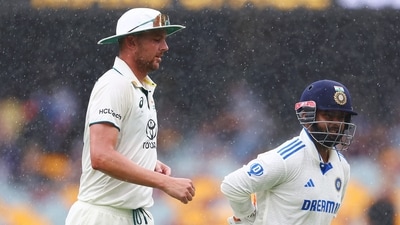 Josh Hazlewood and Rishabh Pant walk off due to rain at the Gabba on day three of the Test. (BCCI- X) Josh Hazlewood and Rishabh Pant walk off due to rain at the Gabba on day three of the Test. (BCCI- X)