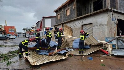 Rescue workers clearing an area in the French territory of Mayotte in the Indian Ocean, after Cyclone Chido caused extensive damage with reports of several fatalities. (AP) Rescue workers clearing an area in the French territory of Mayotte in the Indian Ocean, after Cyclone Chido caused extensive damage with reports of several fatalities. (AP)